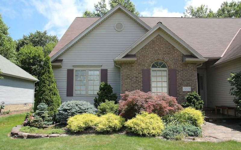 House with bushes in the foreground