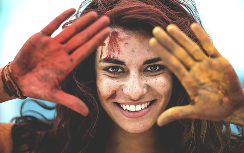 woman holding hands in her face to make a frame