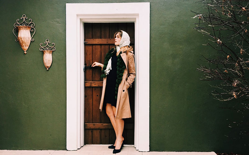 woman standing by the door